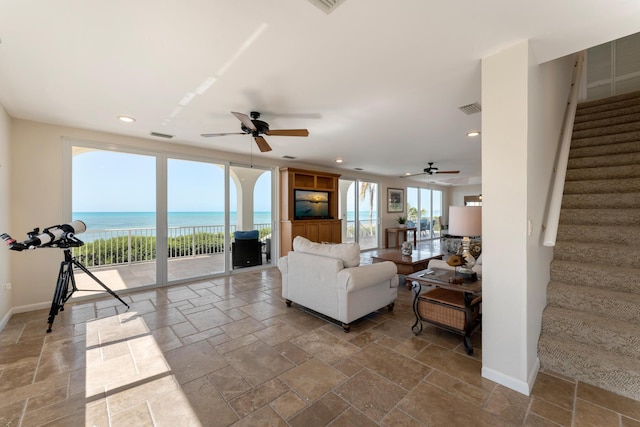 228 W Seaview Cir, Duck, FL 33050 - living area with ceiling fan, stone tile flooring, stairs, and recessed lighting