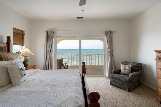 228 W Seaview Cir, Duck, FL 33050 - carpeted bedroom with access to exterior, a water view, and ceiling fan