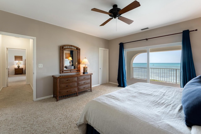 228 W Seaview Cir, Duck, FL 33050 - bedroom with access to exterior, carpet, baseboards, and a water view