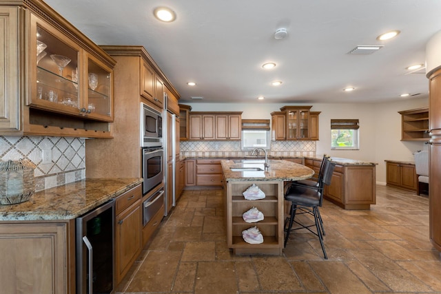228 W Seaview Cir, Duck, FL 33050 - kitchen with open shelves, wine cooler, a warming drawer, stainless steel appliances, and recessed lighting