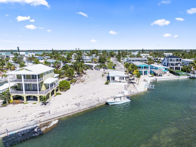 bird's eye view with a view of the beach and a water view