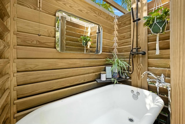 full bath featuring a soaking tub