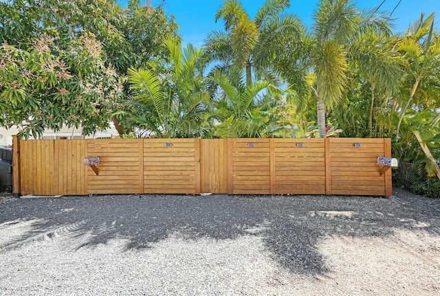 view of gate featuring fence