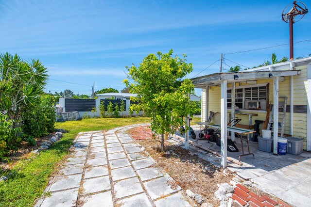 3746 Paula Ave, Key West, FL 33040 - view of green lawn with a patio area and an outdoor structure