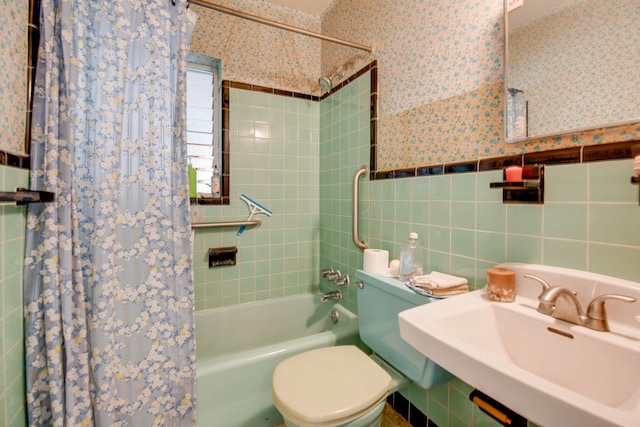 3746 Paula Ave, Key West, FL 33040 - bathroom featuring shower / bath combo, wallpapered walls, a sink, toilet, and tile walls