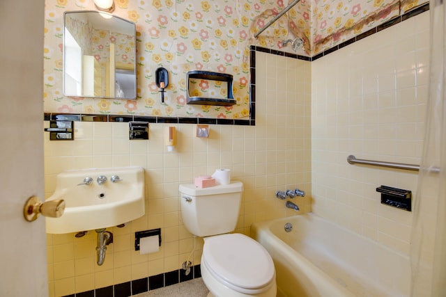 3746 Paula Ave, Key West, FL 33040 - bathroom with wallpapered walls, toilet, a sink, tile walls, and wainscoting