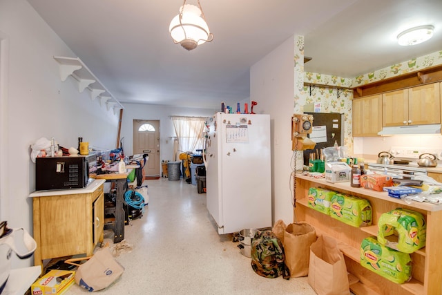 3746 Paula Ave, Key West, FL 33040 - kitchen with under cabinet range hood, white appliances, light brown cabinets, wallpapered walls, and light countertops