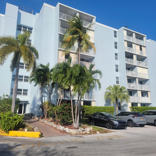 3312 Northside Dr Unit 407, Key West, FL 33040 - view of apartment building / complex featuring uncovered parking