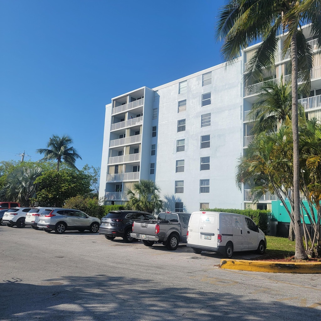 3312 Northside Dr Unit 407, Key West, FL 33040 - view of apartment building / complex featuring uncovered parking
