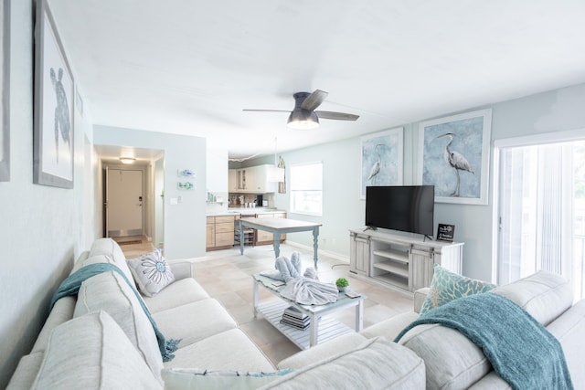 living room featuring ceiling fan