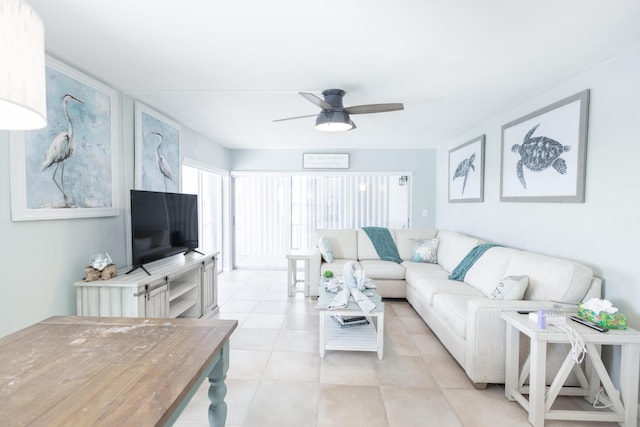 living room featuring light tile patterned floors and ceiling fan