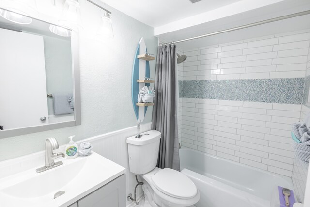 full bathroom with vanity, toilet, and shower / bath combo