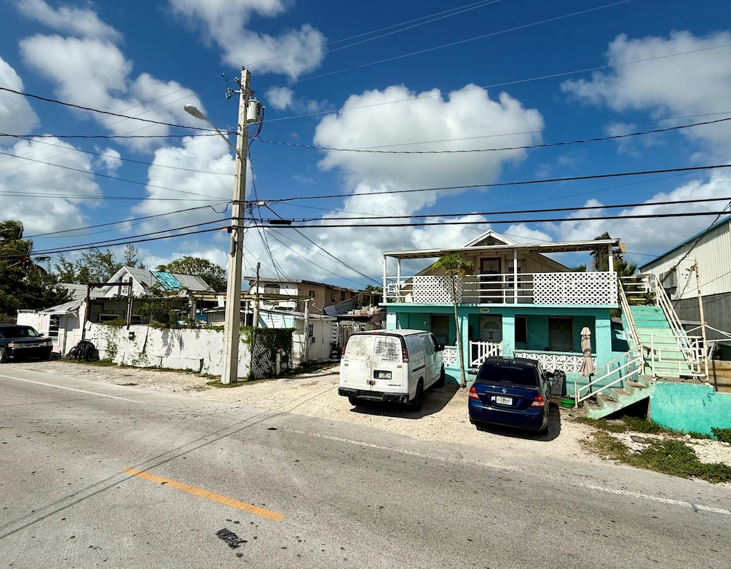 5331 5th Ave, Key West, FL 33040 - view of front of property featuring stairs and uncovered parking