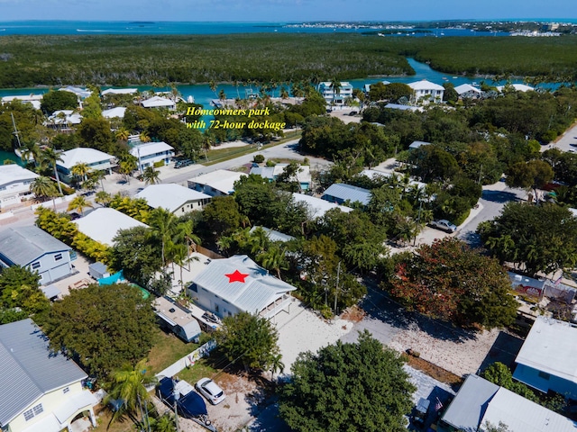 birds eye view of property featuring a water view and a residential view