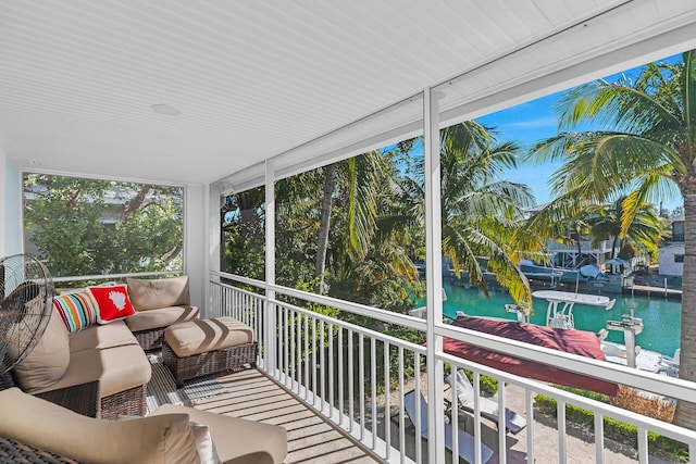 sunroom with a water view