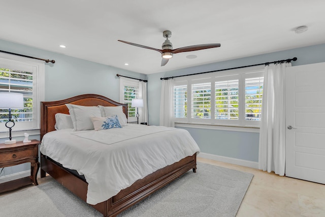 bedroom with multiple windows and ceiling fan