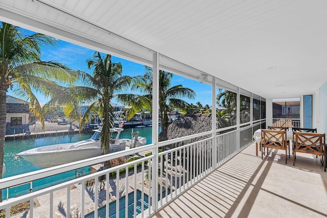 sunroom with a water view