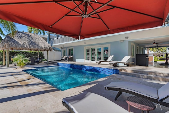 view of pool with a gazebo, a patio area, and ceiling fan