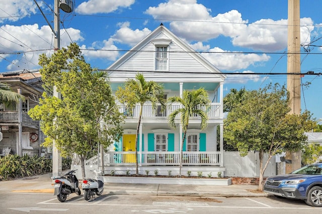 view of front of house with a porch and a balcony