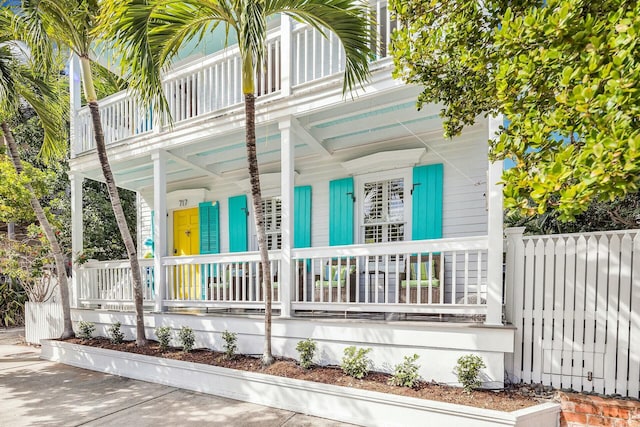 exterior space with a balcony and covered porch