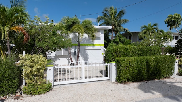 view of gate with a fenced front yard