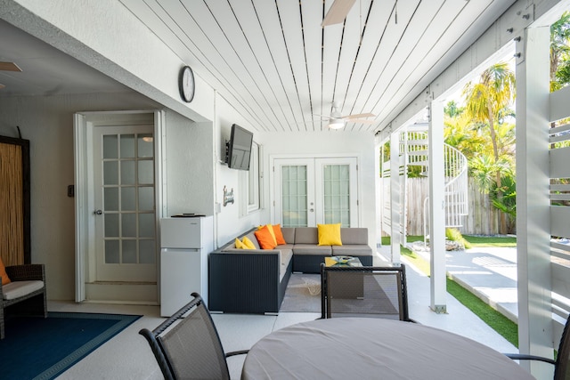 sunroom featuring french doors