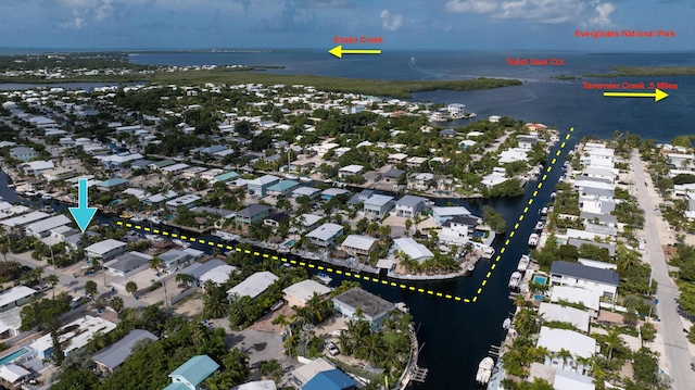 aerial view with a water view and a residential view