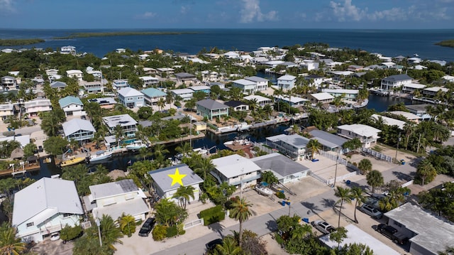 aerial view featuring a water view and a residential view