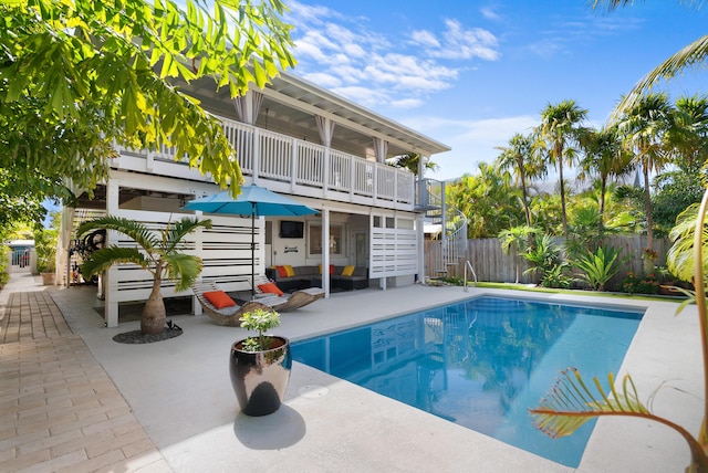 view of pool featuring fence, an outdoor living space, a fenced in pool, and a patio