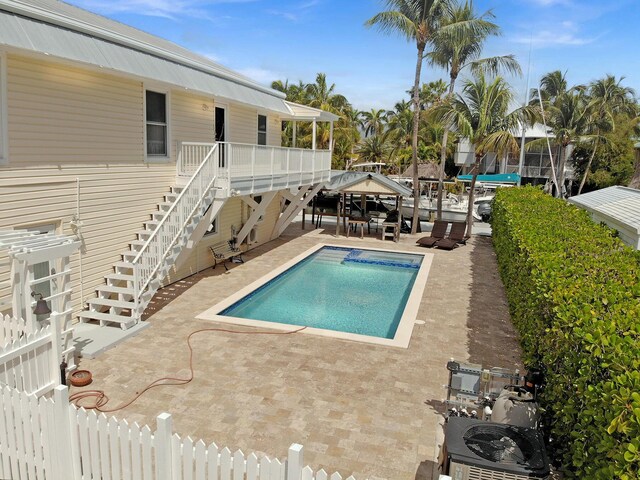 rear view of property with a gazebo and a patio area