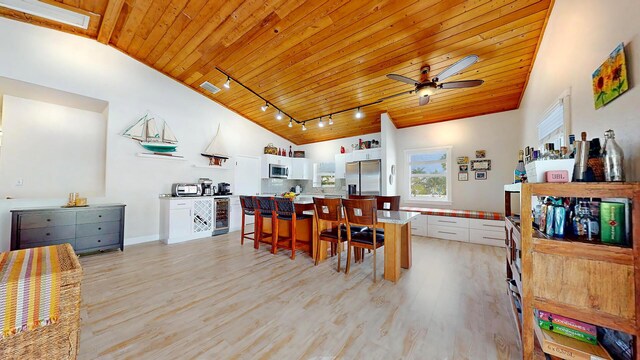 living room with ceiling fan, wooden ceiling, high vaulted ceiling, and light wood-type flooring