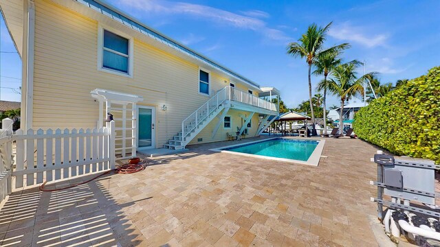 deck featuring a water view and ceiling fan