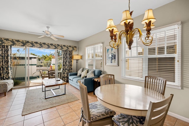 dining area featuring tile patterned flooring, baseboards, and ceiling fan