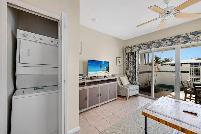 living area featuring light tile patterned floors and ceiling fan