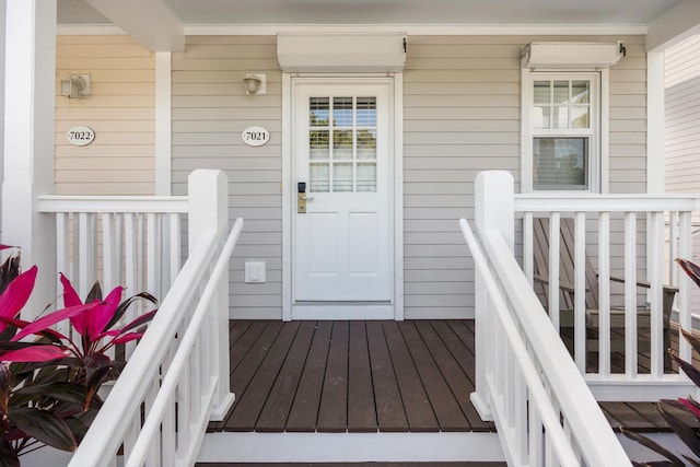 view of exterior entry featuring a porch