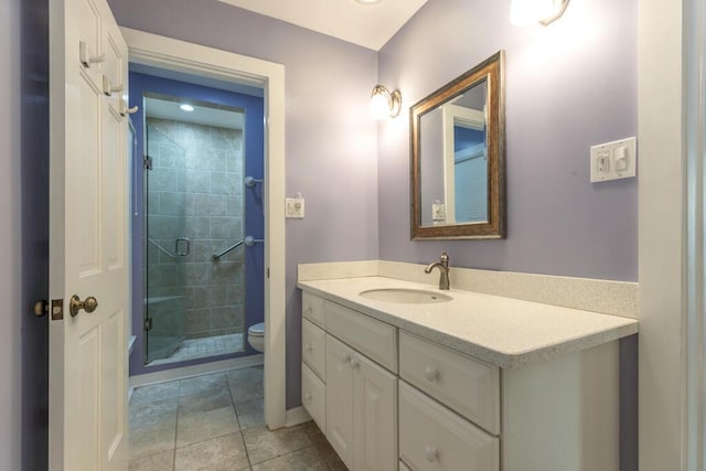 bathroom with walk in shower, vanity, toilet, and tile patterned flooring