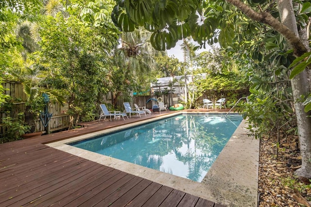 view of swimming pool with a deck