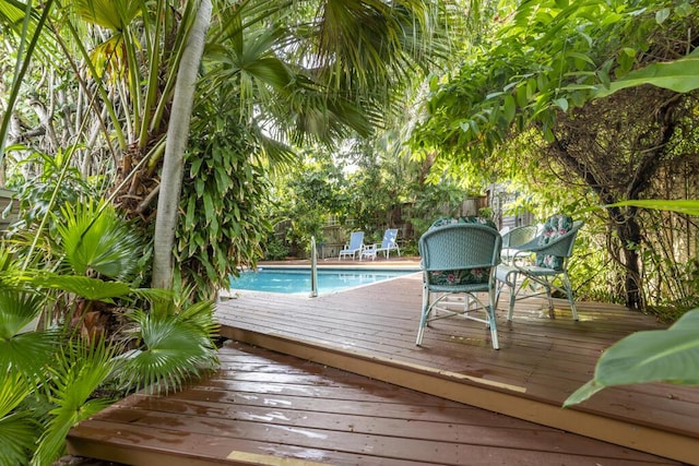 view of pool with a wooden deck