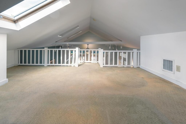 additional living space with lofted ceiling and carpet flooring