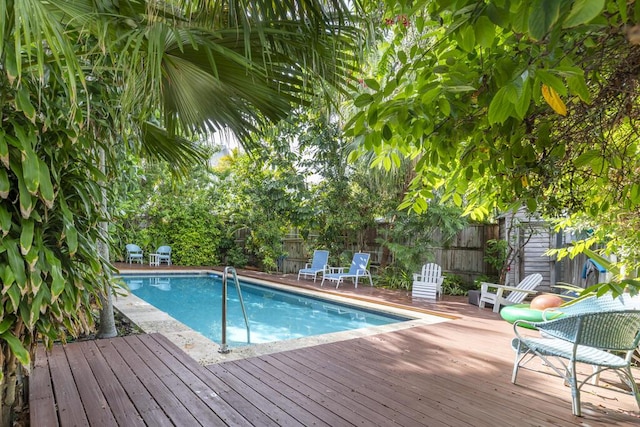 view of swimming pool with a deck