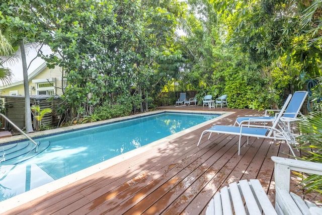 view of swimming pool featuring a deck