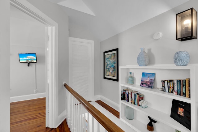 corridor with dark hardwood / wood-style floors