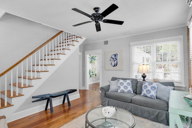 living room with crown molding, ceiling fan, and hardwood / wood-style floors