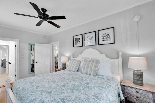 bedroom with crown molding and ceiling fan