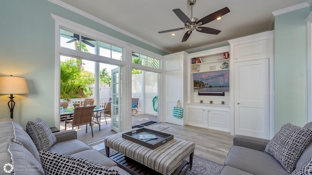 living room with ceiling fan, ornamental molding, and light hardwood / wood-style floors