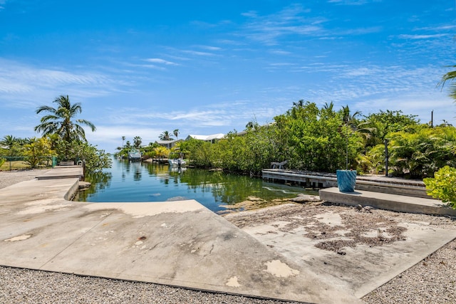 property view of water with a dock