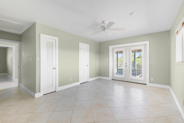 tiled spare room with french doors and ceiling fan