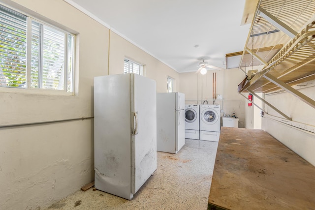 laundry area with sink, washer and dryer, and a wealth of natural light