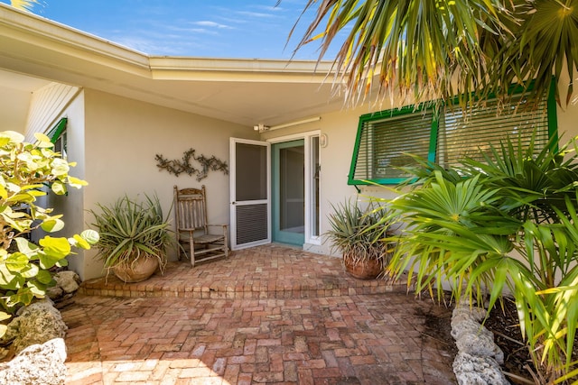 property entrance with a patio