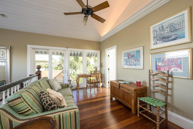 living room featuring vaulted ceiling, dark wood-type flooring, crown molding, and ceiling fan